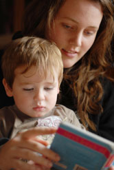 Mother reading a book to toddler
