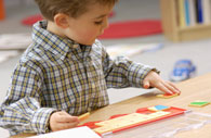Boy matching cards on form